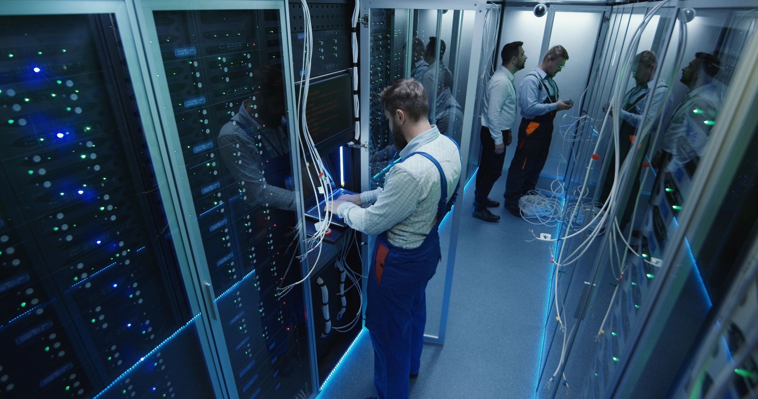 Technicians working in a professional telecommunications server environment